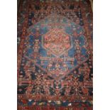 A Kurdish blue ground rug, 198 x 135cm
