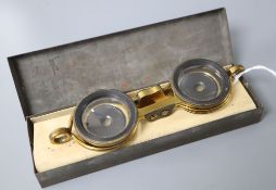 A pair of Aitcheson patent gilt metal folding opera glasses