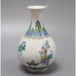 A Chinese doucai figurative bottle vase, bears Yongzheng mark, height 17cmCONDITION: In good