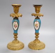 A pair of French gilt metal and porcelain candlesticks, height 27cm