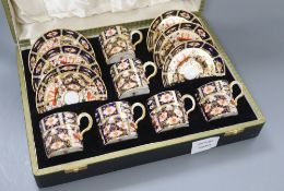 A Royal Crown Derby coffee set, cased