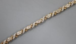 A modern 375 yellow metal and diamond chip set line bracelet, 18.9cm, gross 7.4 grams.