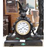 A Victorian malachite black slate mantel clock, with spelter bird surmount