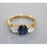 A modern 18ct gold, sapphire and diamond three stone ring, size L, gross 3 grams.CONDITION: Diamonds