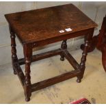 An early 18th century and later oak rectangular topped table, with baluster supports and all round