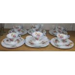 A Shelley part teaset comprising six cups, saucers and plates including a cake plate