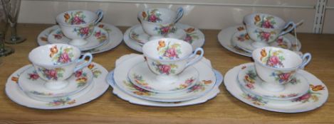 A Shelley part teaset comprising six cups, saucers and plates including a cake plate