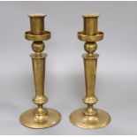 A pair of 20th century bell-metal candlesticks, height 31cm