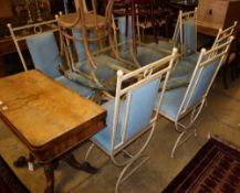 An enamelled metal dining suite comprising a circular glass-topped table and a set of eight