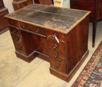 A George IV mahogany kneehole desk, with recessed cupboard, W.115cm, D.60cm, H.76cmCONDITION: The