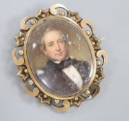 A 19th century yellow metal mounted oval mourning pendant brooch, inset with portrait on a