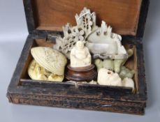 A collection of carved miniature ivory and hardstone carvings
