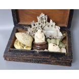 A collection of carved miniature ivory and hardstone carvings