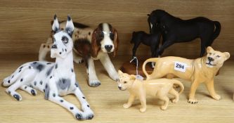 A Beswick black beauty and foal lioness and cub, two unnamed models of dogs, tallest 21cm