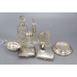 Five assorted silver mounted toilet bottles, a silver condiment, two silver cigarette cases etc.