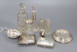 Five assorted silver mounted toilet bottles, a silver condiment, two silver cigarette cases etc.