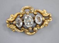 A Victorian pierced scroll yellow metal and three stone aquamarine set pendant brooch, 45mm, gross