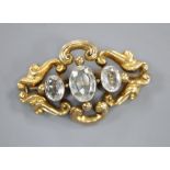 A Victorian pierced scroll yellow metal and three stone aquamarine set pendant brooch, 45mm, gross