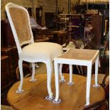 A Louis XVI style painted cane back chair and a caned dressing stool