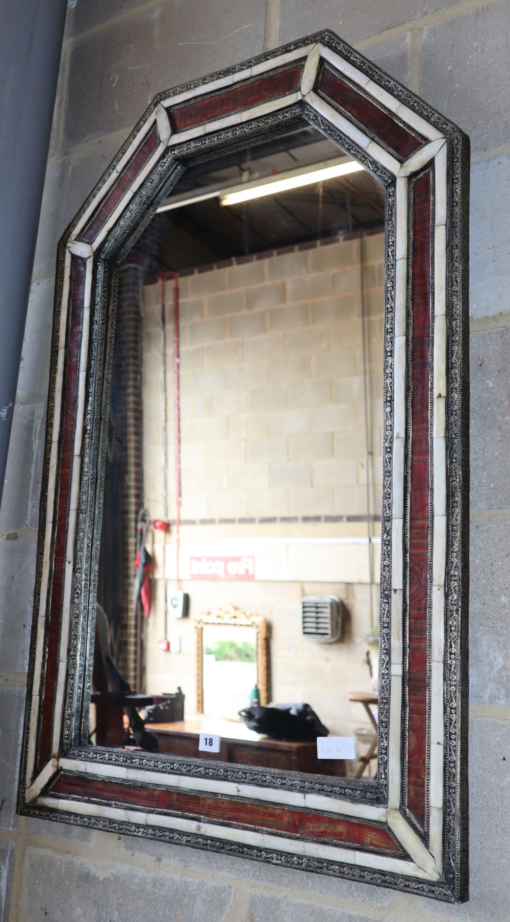 A Moroccan arched top wall mirror, W.70cm, H.108cm