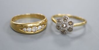 Two early 20th century 18ct and diamond rings, channel set graduated five stone and rose cut diamond