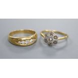 Two early 20th century 18ct and diamond rings, channel set graduated five stone and rose cut diamond