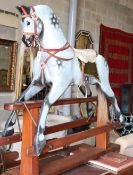 A mid 20th century Collinson dapple grey rocking horse on pine safety frame (restored by Stevenson