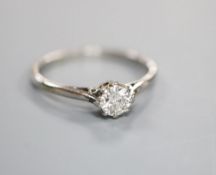 A white metal and solitaire diamond ring, size J/K, gross 2 grams, stone weighing approximately 0.