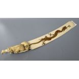 A carved ivory letter opener, with hand painted enamel gilt dragon, length 34cm