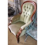 A Victorian mahogany spoonback armchair