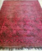 An Afghan red ground carpet, approx. 200x 260cm