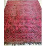 An Afghan red ground carpet, approx. 200x 260cm