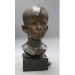 A bronze bust of a boy, signed R.Swann 1930, on marble base, height 38cm, some scuffing to the