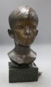 A bronze bust of a boy, signed R.Swann 1930, on marble base, height 38cm, some scuffing to the