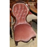 A Victorian walnut pink dralon upholstered spoonback chair