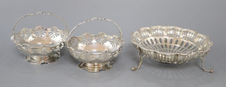 A pair of George V pierced silver bonbon baskets, Birmingham, 1913 and an Edwardian pierced silver