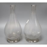 A pair of glass carafe vases, height 30cm