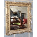 A giltwood and gesso wall mirror, W.74cm, H.86cm, aperture 51 x 62cm