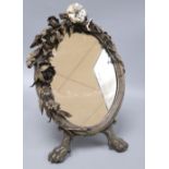 A floral bronze oval easel mirror, with single enamelled flower, length 41cm