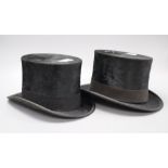 Two vintage black top hats, interior initialled AWL and AEL, length 19.5 width 15.5cm