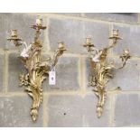 A pair of rococo ormolu three branch wall lights, French, c.1860, H.52cm