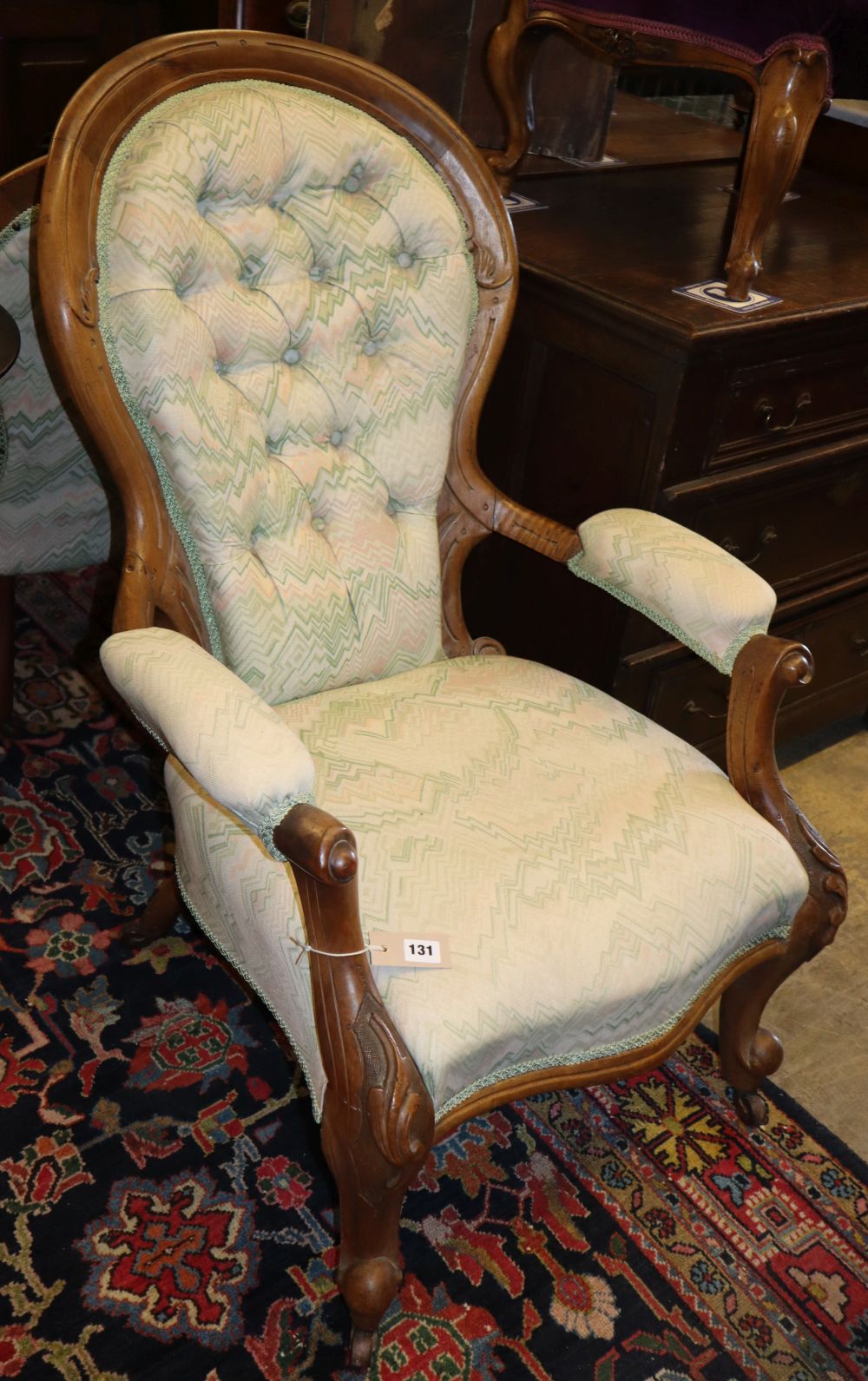 A Victoian buttonback armchair and matching nursing chair