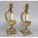 A pair of gilt metal and ivorine sword hilt candlesticks, height 28cm