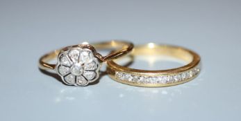 A modern 18ct gold and channel set diamond half eternity ring, size N and an earlier 18ct and