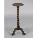 A late 17th century Dutch walnut candle stand, with floral marquetry decorated top and barley