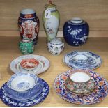 A collection of mixed Chinese and Japanese porcelain and pottery including a Nanking Cargo blue