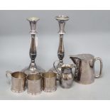 A pair of plated candlesticks and sundries, comprising a set of three plated cup/glass holders by
