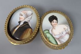 A pair of oval gilt metal boxes, each with inset oval porcelain portrait plaques