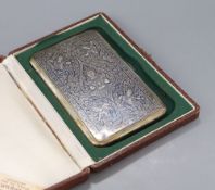 A cased mid 20th century Siamese sterling and niello cigarette case, 13.8cm, gross 5oz, with