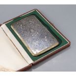 A cased mid 20th century Siamese sterling and niello cigarette case, 13.8cm, gross 5oz, with